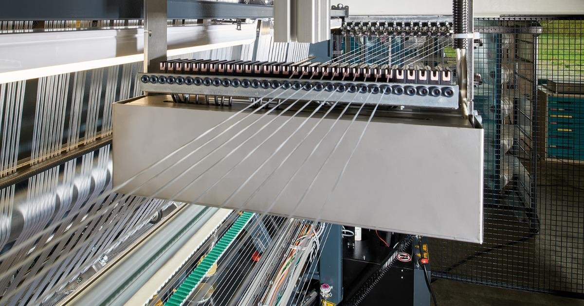 Flexible warp knitting machine with weft insertion and more - Knitting ...